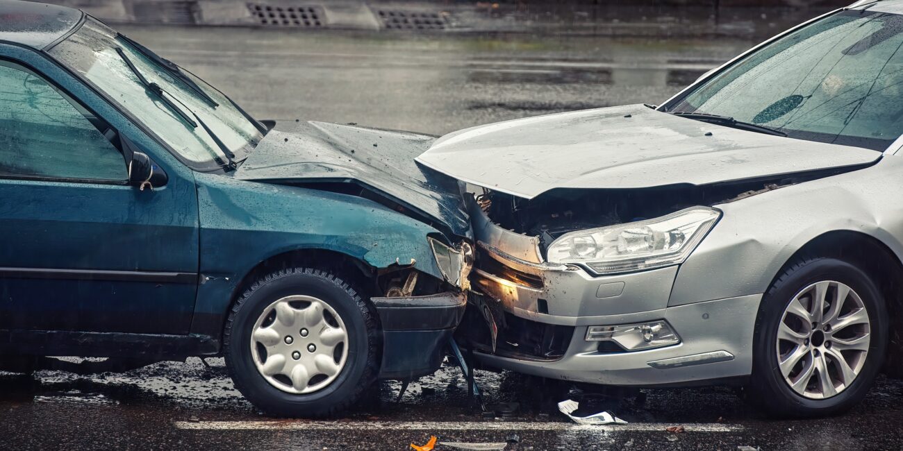 Two cars in head on collision