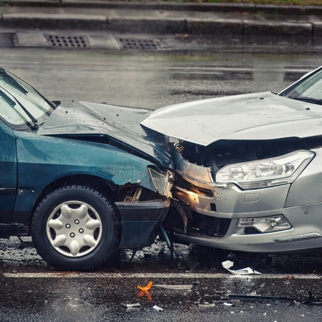 Two cars in head on collision