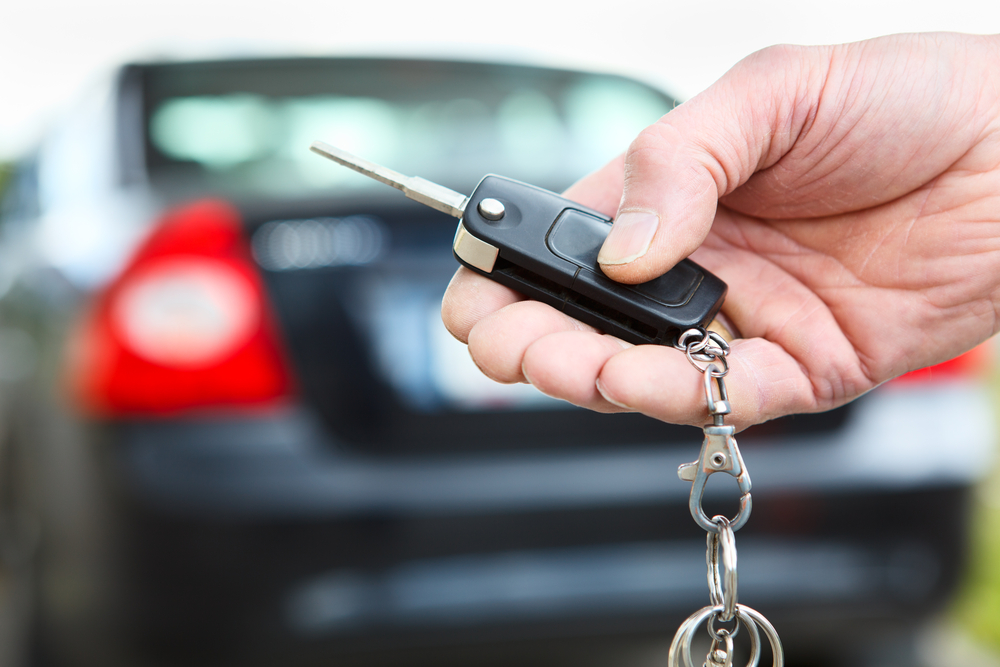 hand holding rental car key