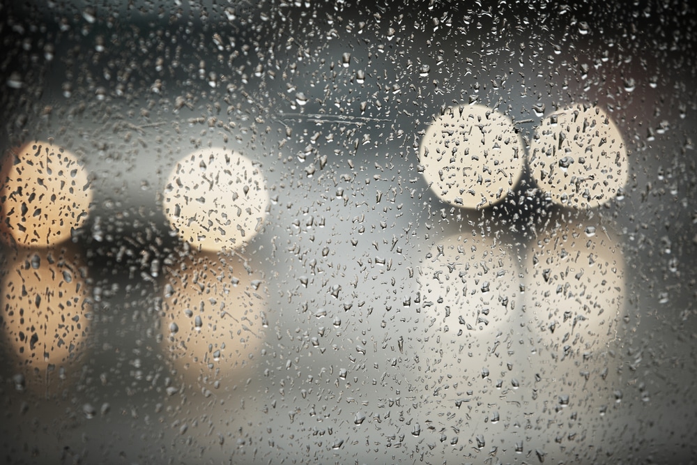 Car headlights in a rainstorm